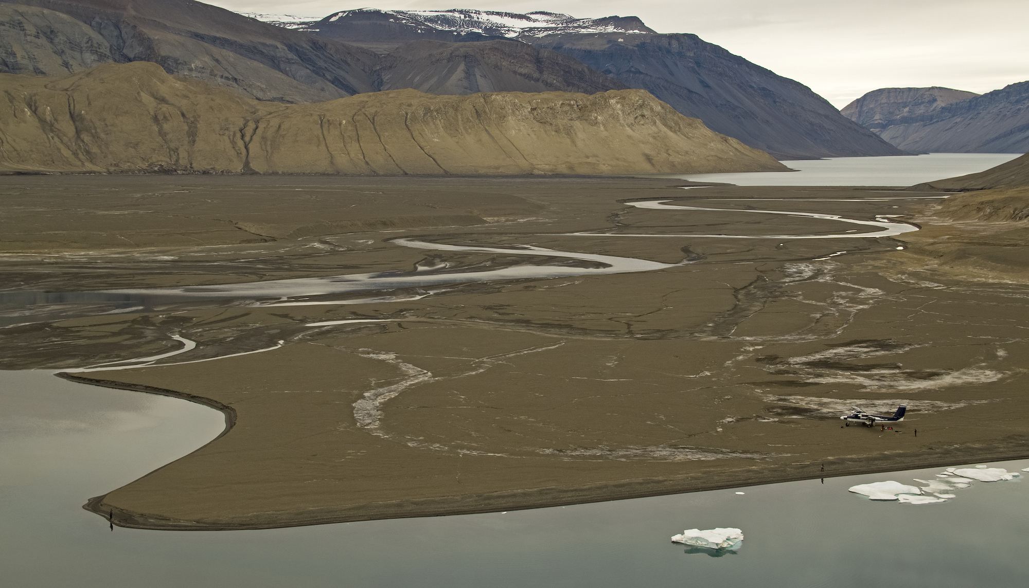 Twin otter on Axel Heiberg stopping to fish